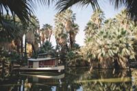 The Oasis of Mara, with a houseboat floating in the center