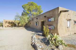 Front view of Irene's Adobe and Dark room and Bottle room