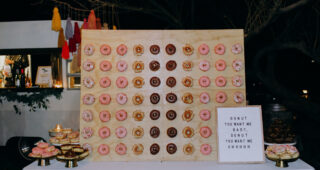 Donuts on wall, along with donuts on platters
