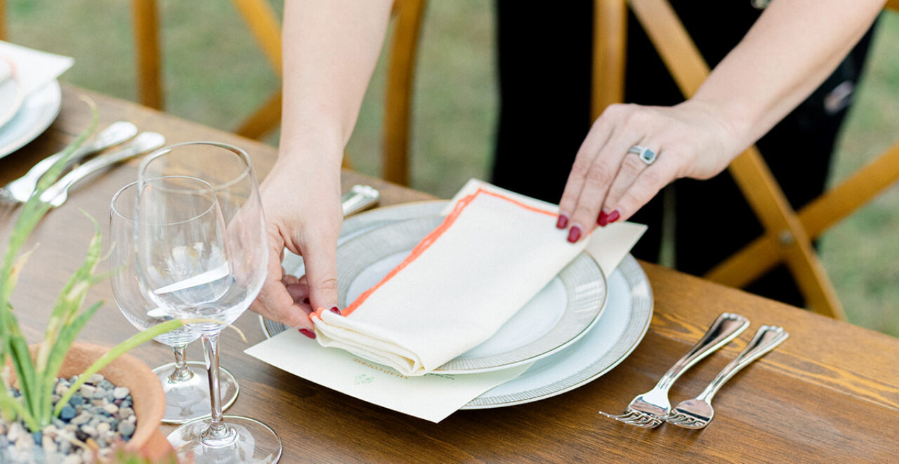 Wedding planner setting up tables