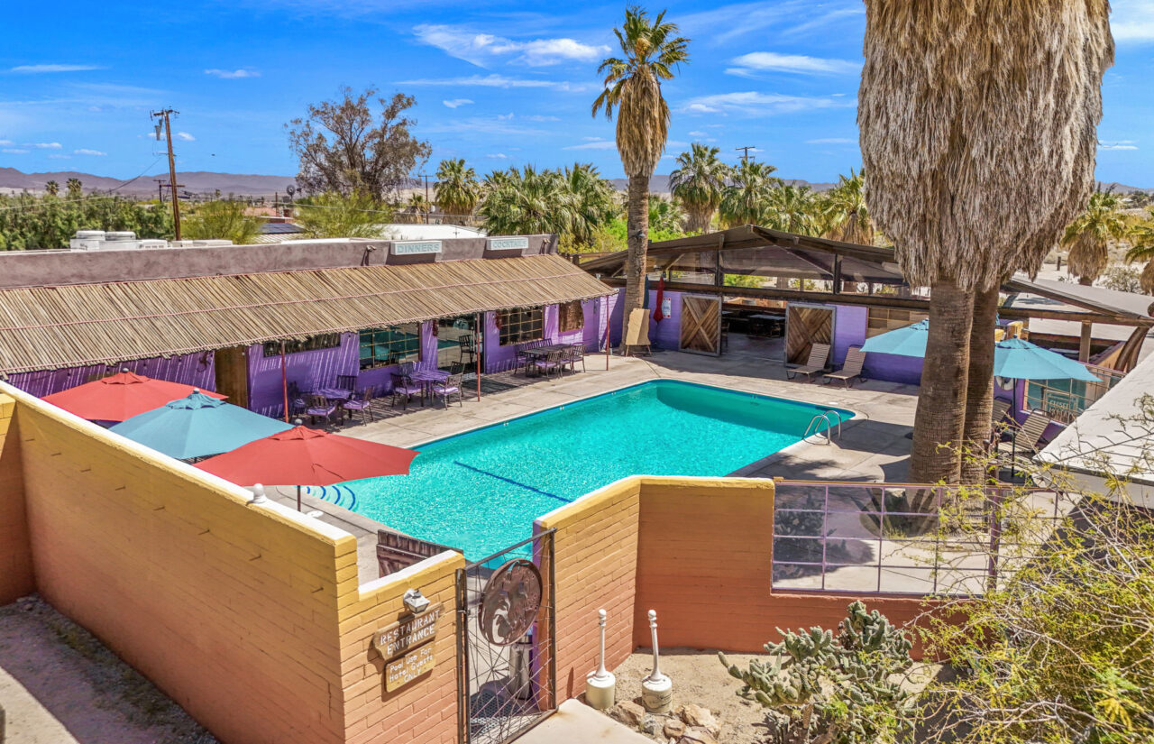 Aerial shot of pool, restaurant and tent