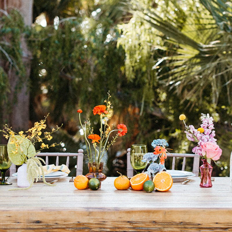 Table set with vibrant floral arrangements
